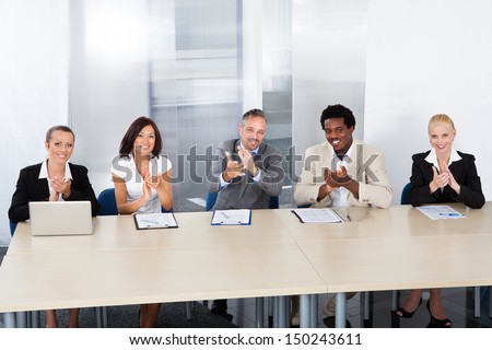 Group Of Corporate Personnel Officers Applauding In Office