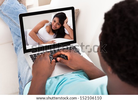 Man And Woman Communicate Through Video Chat On Modern Electronic Digital Tablet