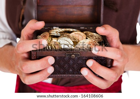 Happy Young Pirate Holding Treasure Box Over White Background