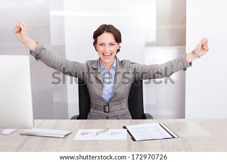 Successful Excited Young Businesswoman With Hand Extended
