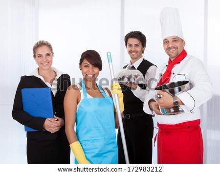 Four People Of Different Occupations Standing Together