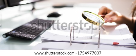 Auditor Investigating Corporate Fraud Using Magnifying Glass Stock foto © 
