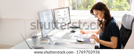 Accountant Using E Invoice Software At Computer In Office