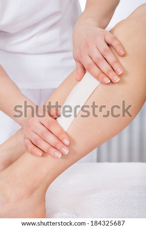 Close-up Of A Woman Getting Thigh Massage Treatment At Spa