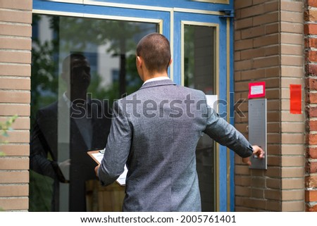 Bailiff Debt Collector Touching Doorbell. Confiscation And Seizure