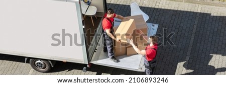 Furniture Removal Using Truck. Mover With Box Stockfoto © 