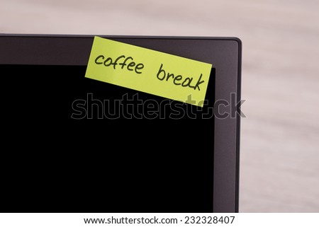 Closeup of Coffee Break sticky note message on laptop screen