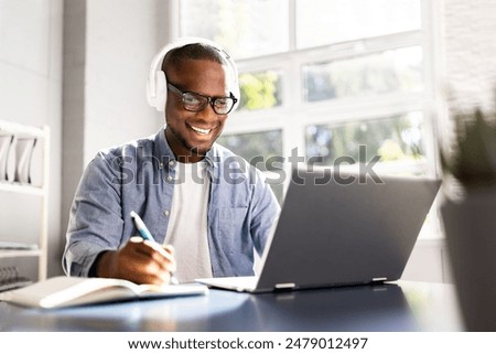 Similar – Image, Stock Photo Student learning at home. Young woman making notes, reading and learning from notepad. Girl writing journal sitting in bed