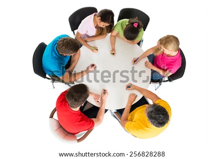High Angle View Of People Sitting On Chair Writing On Desk