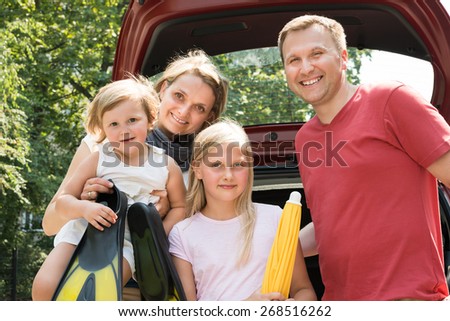Happy Family Traveling By Car. Outdoors Shot