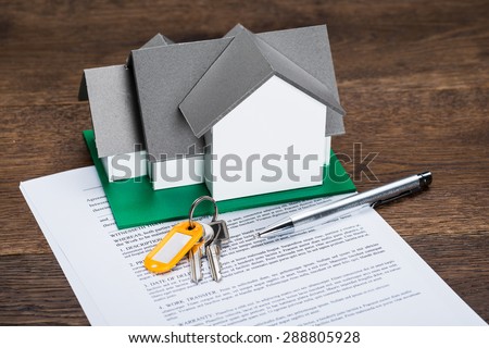 House Model With Keys And Ballpen On Contract Paper