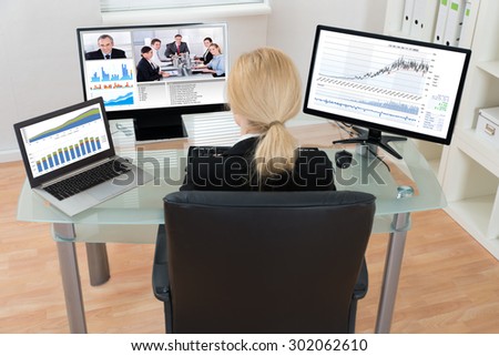 Young Businesswoman Video Conferencing With Colleagues On Computer