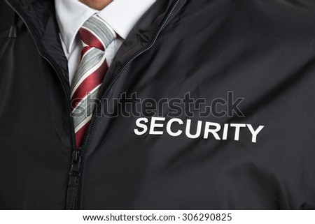 Close-up Of Security Guard Wearing Uniform With The Text Security