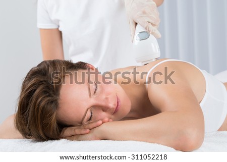 Young Beautiful Woman Getting Epilation Laser Treatment