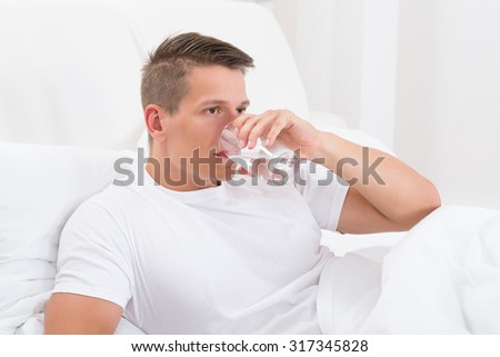 Similar – Image, Stock Photo Man resting in water with guitar at seaside