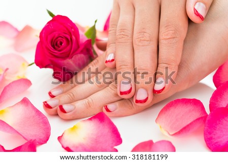Close-up Of Female Hands With Manicured Red Nail Varnish