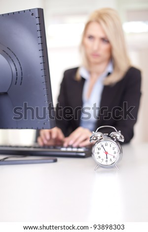 Beautiful businesswoman trying to meet a deadline in the office