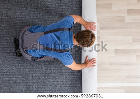 Similar – Image, Stock Photo young handyman installing wooden floor