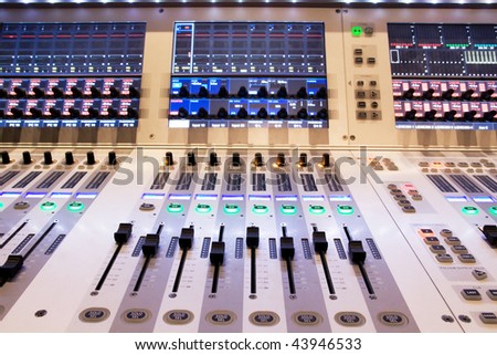 professional audio mixer in a recording studio