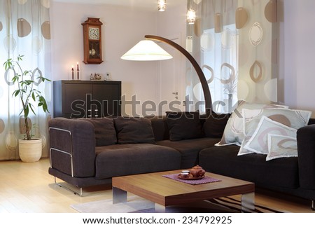Private house interior. Guest room, desk, floor lamp. Indoors.