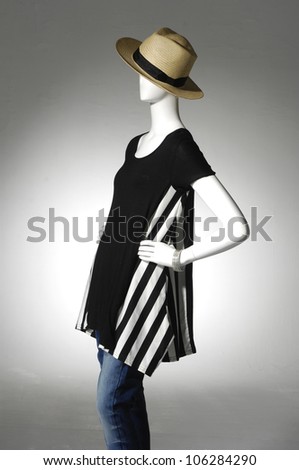 Woman cloth in hat on female mannequin,isolated