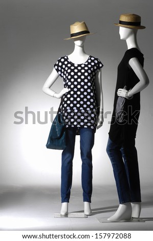 full length fashion female clothes in jeans with hat on a mannequin holding bag