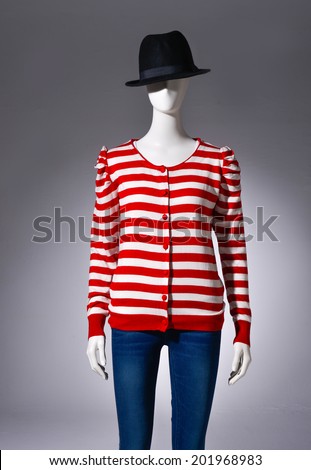 female striped shirt clothing in hat on mannequin-gray background
