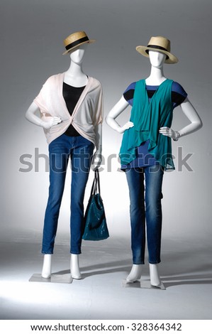 full-length two female in hat with bag on mannequin in light background