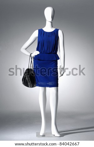 female fashion blue dress on mannequin on light background
