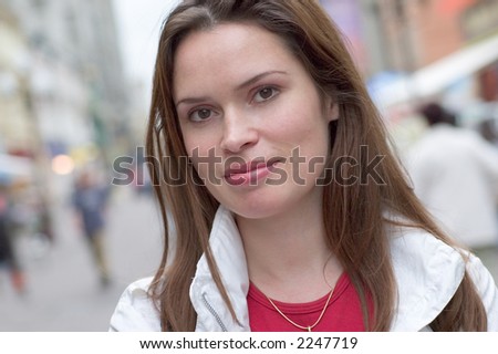 Photo of a woman caught at the street in casual manner