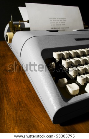 a typewriter on a wooden desk