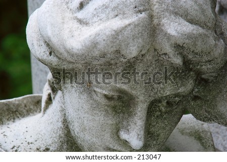 Sad statue at a cemetery