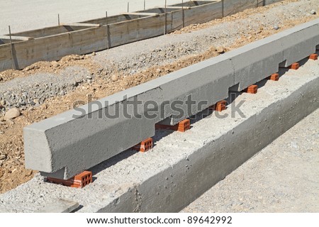 Concrete curb at road construction site. The road is ready to be asphalted.Shallow DOF