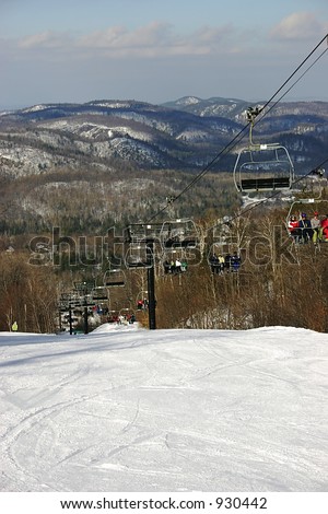 Ski Chair-Lift with Mountainous Background