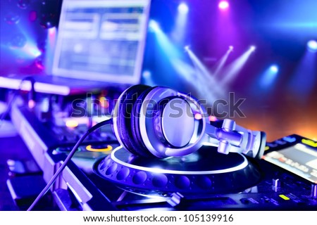 Dj mixer with headphones at nightclub Сток-фото © 