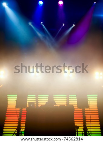 DJ at a nightclub on the scene for a game. Bright beautiful lighting