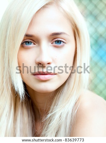 Portrait of attractive beautiful blonde girl with blue eyes