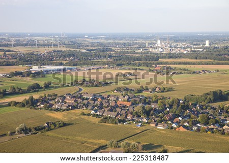 Landscape with homes, industry and agriculture in the Lower Rhine Region of Germany - Aerial view of Kamp-Lintfort, North Rhine-Westfalia, Germany, Europe