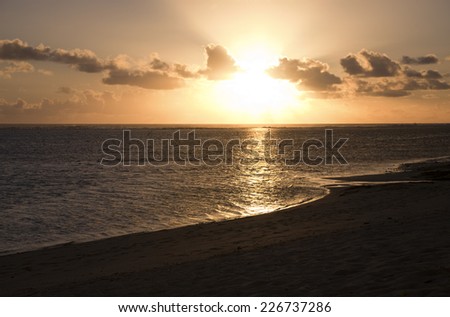 Sun shining through Clouds at Sunset - South Pacific Ocean, Rarotonga, Cook Islands, Polynesia