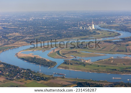 Rhine River bend Orsoy with agricultural, industrial and residential districts in the Lower Rhine Region of Germany - Voerde, North Rhine-Westfalia, Germany, Europe