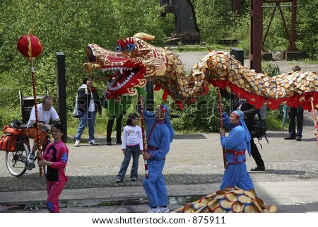 dragon-dance -  three performers and the dragon - chinese new year
