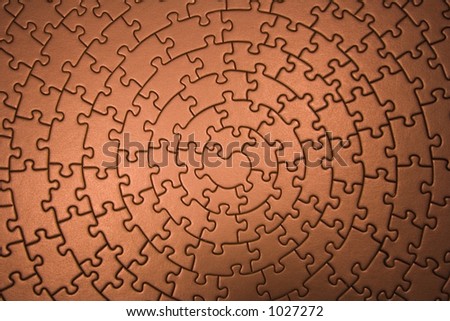 complete jigsaw wide angle in copper - pieces fitting together in form of a spiral