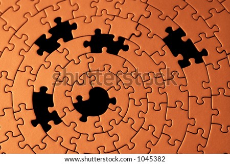 abstract of a jigsaw with five missing pieces - focus is on the center