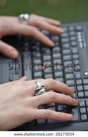 Female Hands typing on Laptop