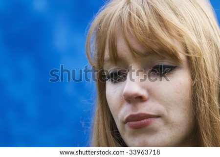 Sad Young Woman with red Hair