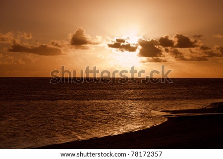 Rays of Sunlight beam from behind Clouds - Sunset over South Pacific Ocean, Rarotonga, Cook Islands, Polynesia