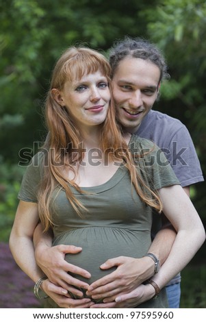 Young Couple in a park awaiting a Baby - Germany, Europe