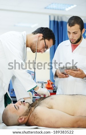 Medical workers taking care of patient at modern hospital