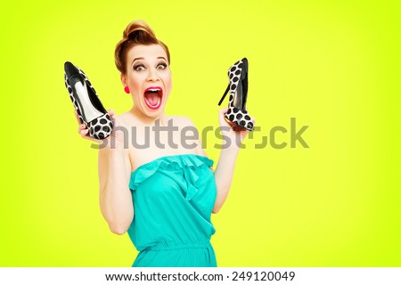 Beautiful pin-up girl gone crazy about new shoes