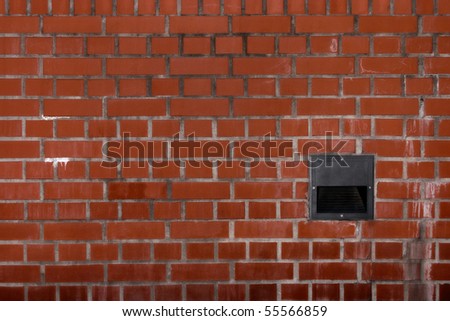 Dirty brick wall with built-in light housing
